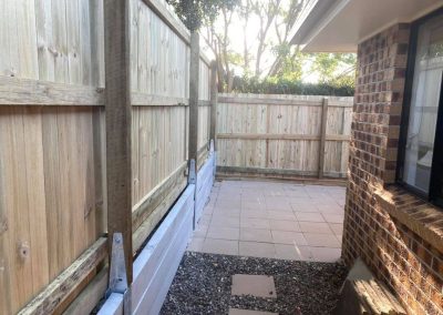 timber side and rear boundary fence on sleeper retainers