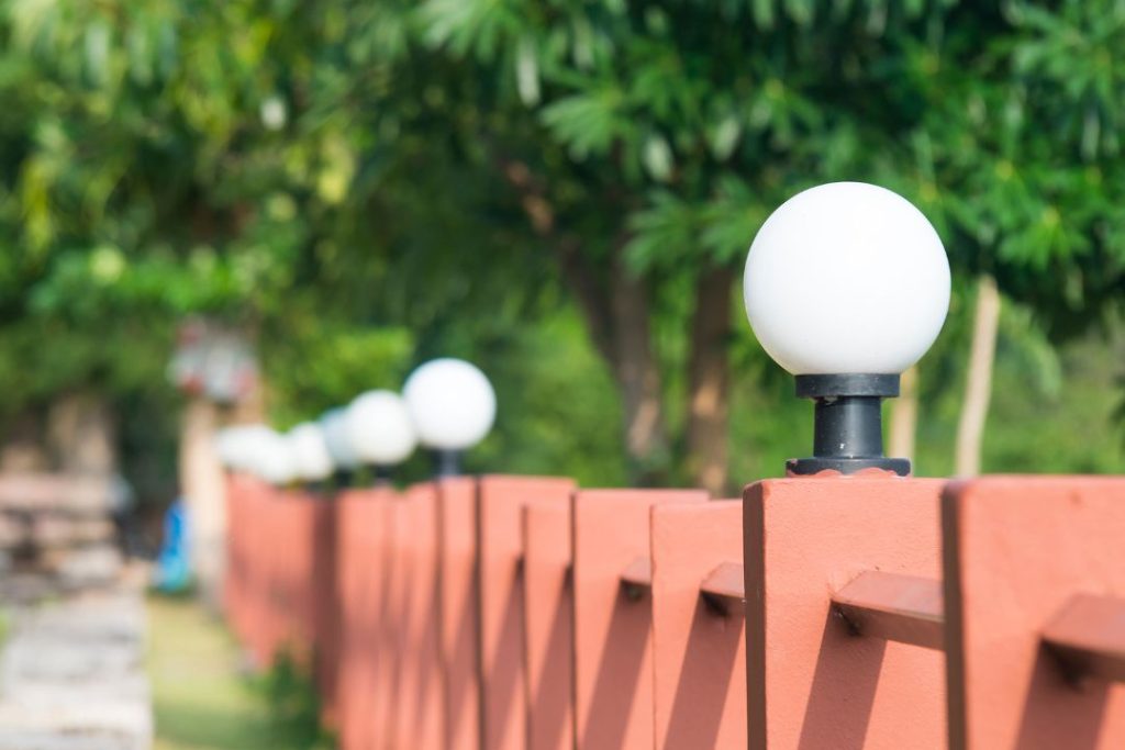 adding lights to your fence create a cosy atmosphere at night
